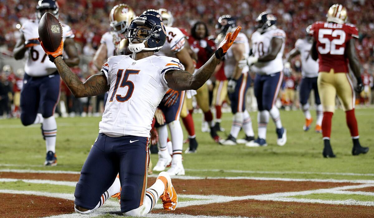 Bears wide receiver Brandon Marshall (15) celebrates after catching a five-yard touchdown pass against the 49ers in the fourth quarter Sunday night in San Francisco.