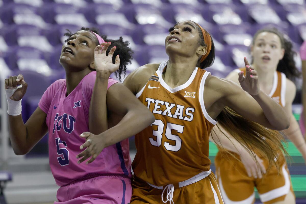 Texas forward Charli Collier battles Texas Christian forward Yummy Morris.