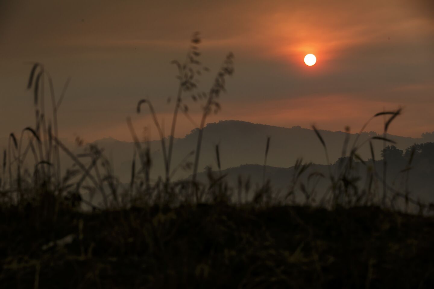 The sun rises through smoky haze from the Sherpa Fire in Goleta on Friday.