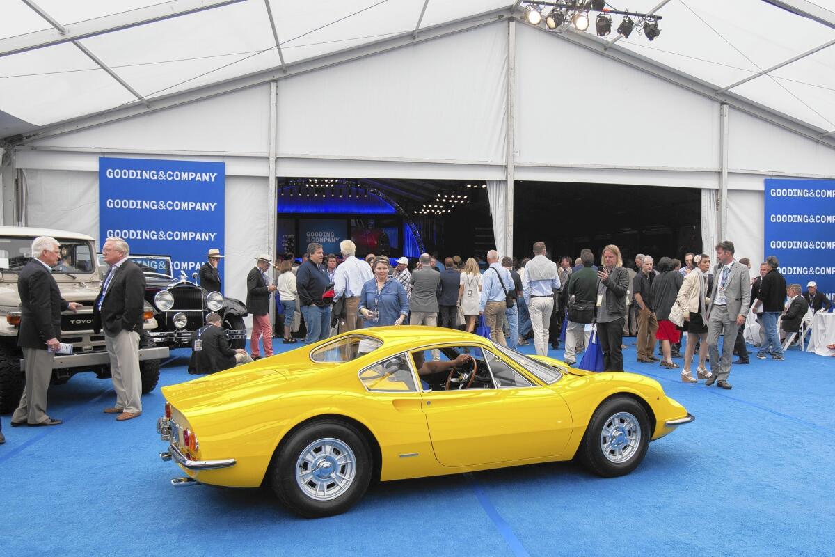 A 1968 Ferrari Dino 206 GT makes its way back on display after selling for $680,000 Sunday at the Pebble Beach Concours d'Elegance in Pebble Beach, Calif.