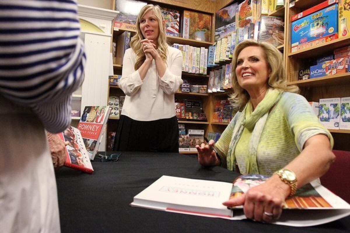 Ann Romney signs copies of her cookbook entitled Ann Romney Family Table at the Flintridge Bookstore in La Canada Flintridge on Tuesday, October 8, 2013. Romney's communications director Leah Malone stands behind her.