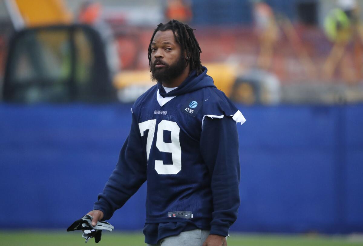 Dallas Cowboys defensive end Michael Bennett walks on the field.