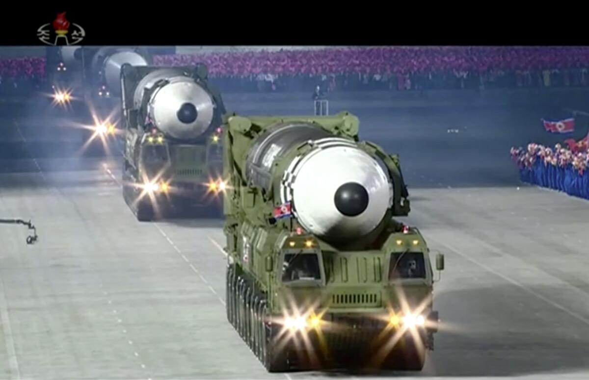 An image from video broadcast by North Korea's KRT shows a parade with what appears to be a solid-fuel missile in Pyongyang.