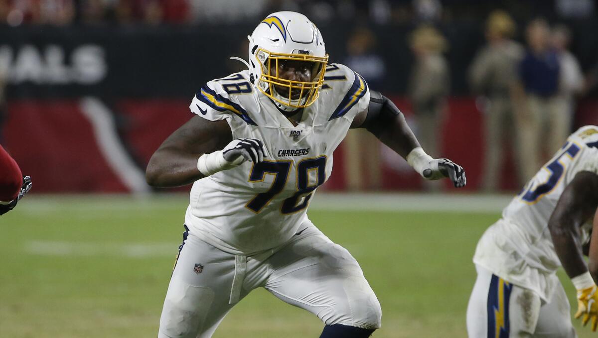 Chargers offensive tackle Trent Scott provides run protection during Thursday's preseason loss to the Arizona Cardinals.