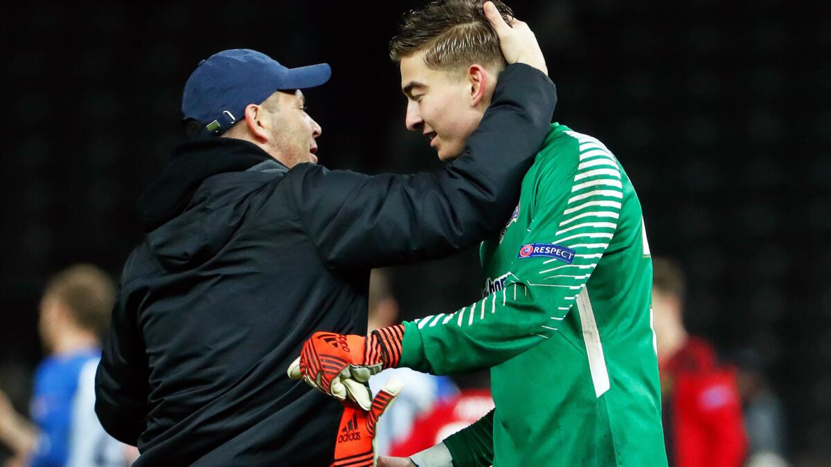 Hertha Berlin coach Pal Dardai congratulates Jonathan Klinsmann after he helped preserve a 1-1 tie with Ostersunds on Dec. 7.