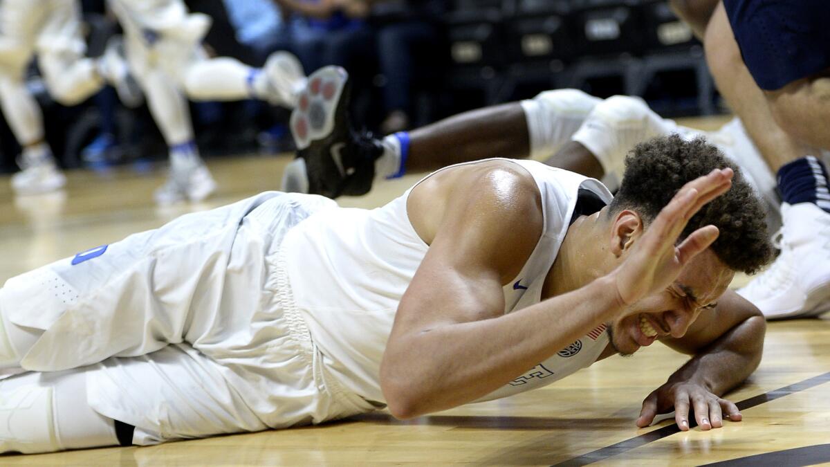 Duke's Chase Jeter reacts after injuring his ankle in the first half Saturday.
