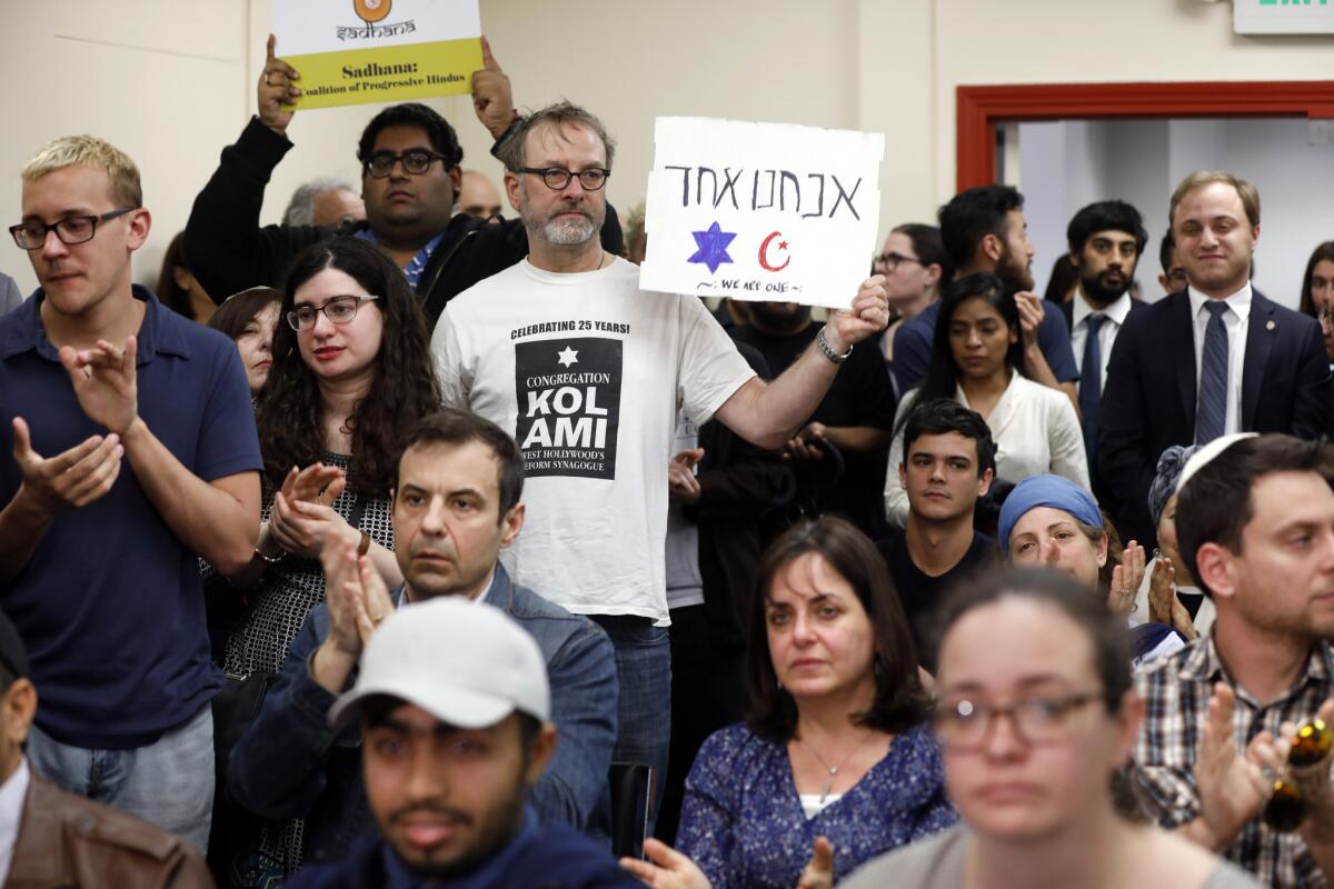 Friday prayers at the Islamic Center of Southern California on Friday attracted members of all faiths and were guarded by police, private security and sheriff's deputies.