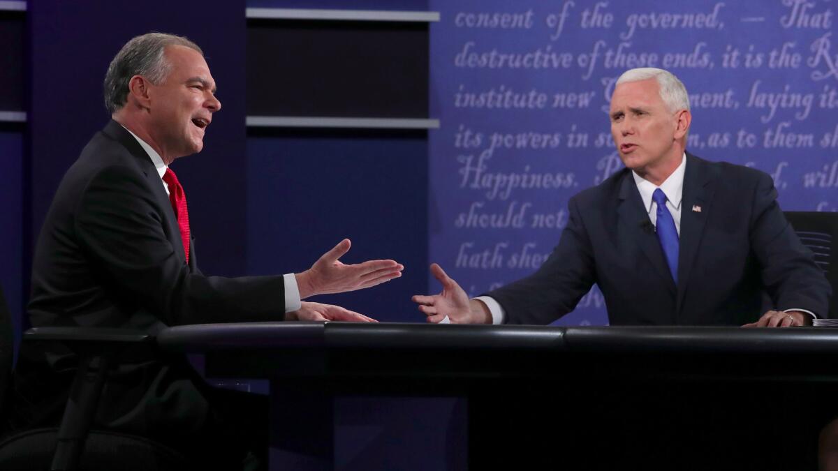 Democratic vice-presidential nominee Tim Kaine, left, and Republican counterpart Mike Pence speak during their debate Tuesday at Longwood University in Farmville, Va.