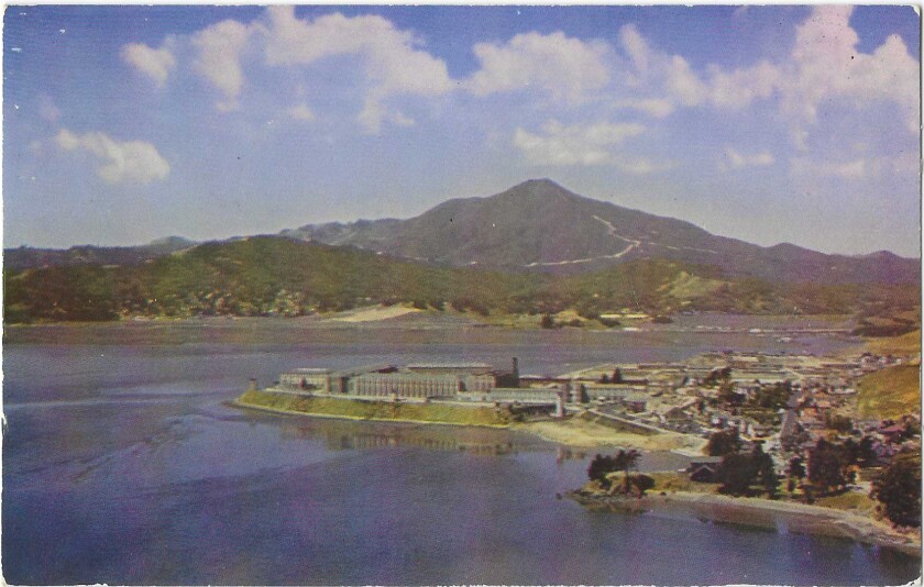 A view of San Quentin prison, on a point jutting into the bay, with Mt. Tamalpais in the background.
