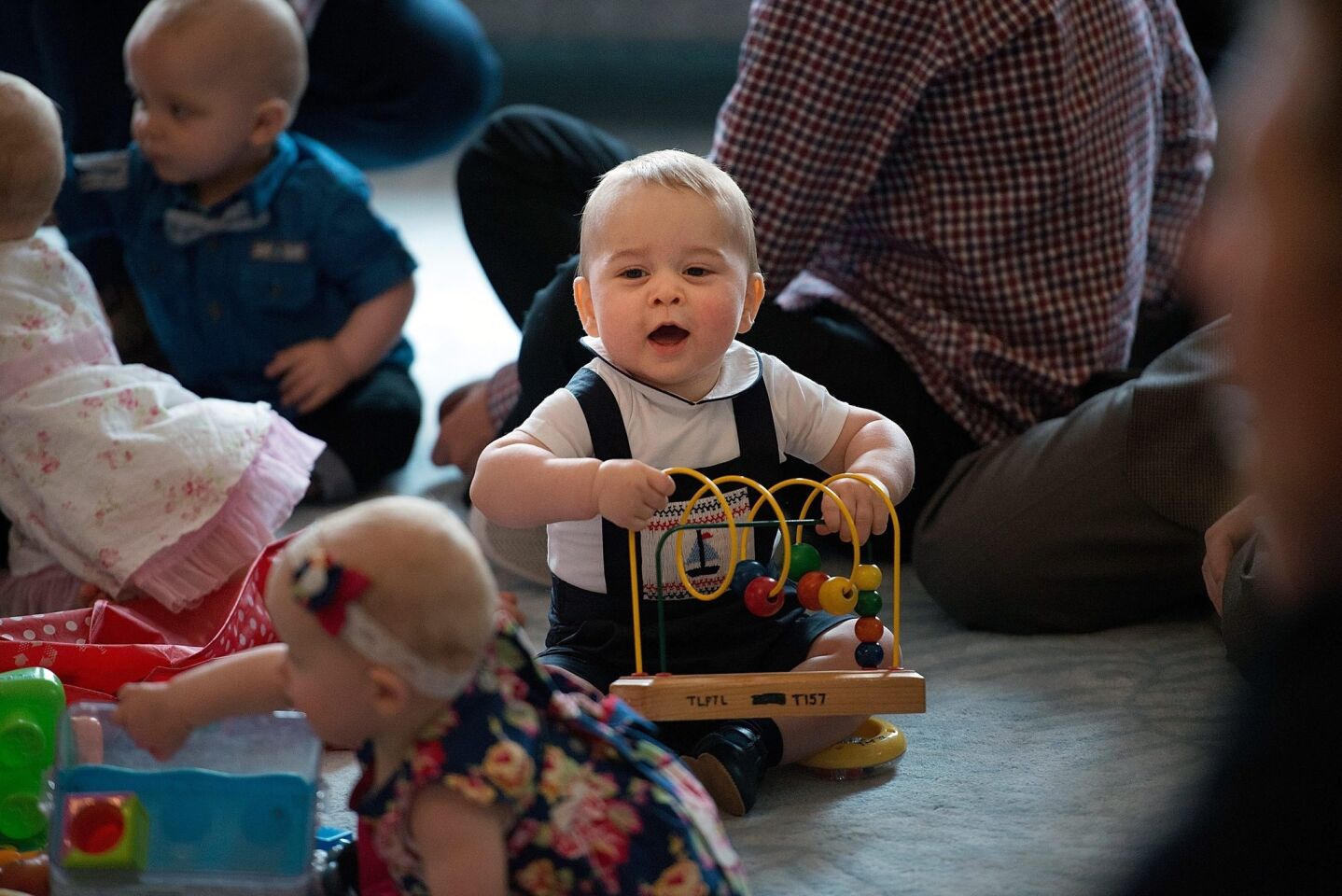 Prince George plays with toys during a play date at Government House in Wellington, New Zealand.