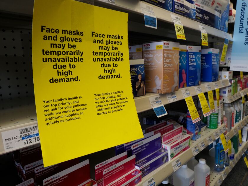 A shelf of sold-out protective masks and low supply of protective gloves at a CVS Pharmacy in Oakland on Thursday.