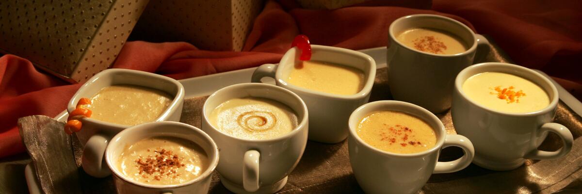 A tray laden with mugs of eggnog.