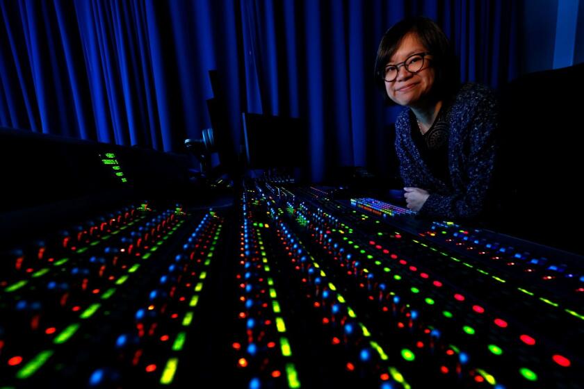 Ai-ling Lee, an Oscar-nominated sound editor and sound mixer for "La La Land," sits at the mix board inside the sound design room at Fox Studios in Los Angeles on.