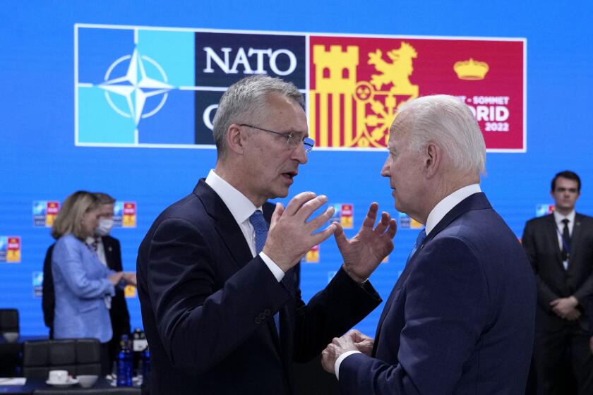 NATO Secretary General Jens Stoltenberg, left, speaks with U.S. President Joe Biden during a round table meeting at a NATO summit in Madrid, Spain on Wednesday, June 29, 2022. North Atlantic Treaty Organization heads of state will meet for a NATO summit in Madrid from Tuesday through Thursday. (AP Photo/Bernat Armangue)