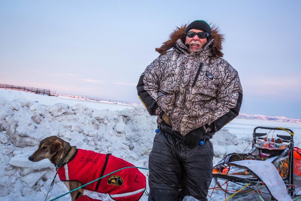 Jeff King, a four-time Iditarod champion, is shown during last year's race. On Saturday, a snowmobile crashed into his team and another in what authorties say was an intentional assault. The driver believed responsible is in custody.