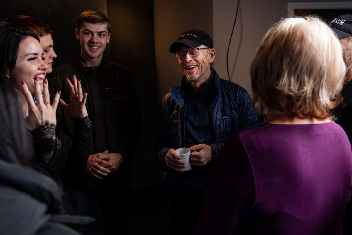 Director Ron Howard from the documentary, “Rebuilding Paradise,” talks with the films subjects after they’re photographed in the L.A. Times Studio at Sundance.