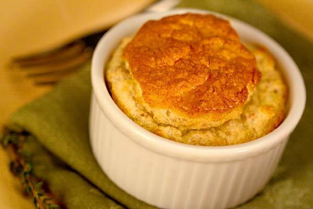 FOR STARTERS: Goat cheese adds a tangy undercurrent to the earthy walnuts in this do-ahead soufflé.