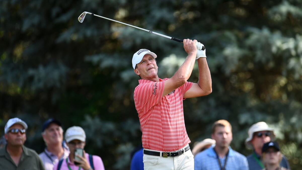 Steve Stricker tees off on the par-three 12th hole during the third round of the U.S. Senior Open in South Bend, Ind. Stricker is seeking his second senior major title after winning the Regions Tradition in May in Alabama.