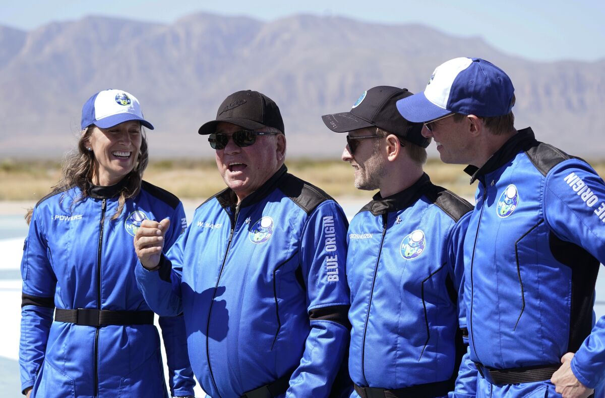 William Shatner, center right, speaks  during a media availability at the Blue Origin spaceport near Van Horn, Texas, Wednesday.