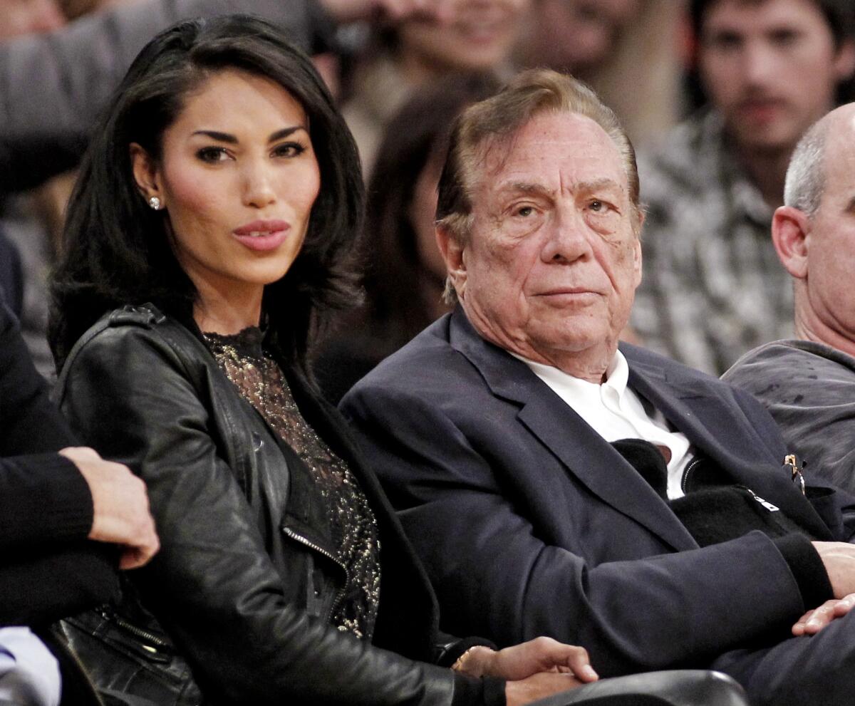 Donald Sterling and V. Stiviano watch a Clippers game together in 2010.