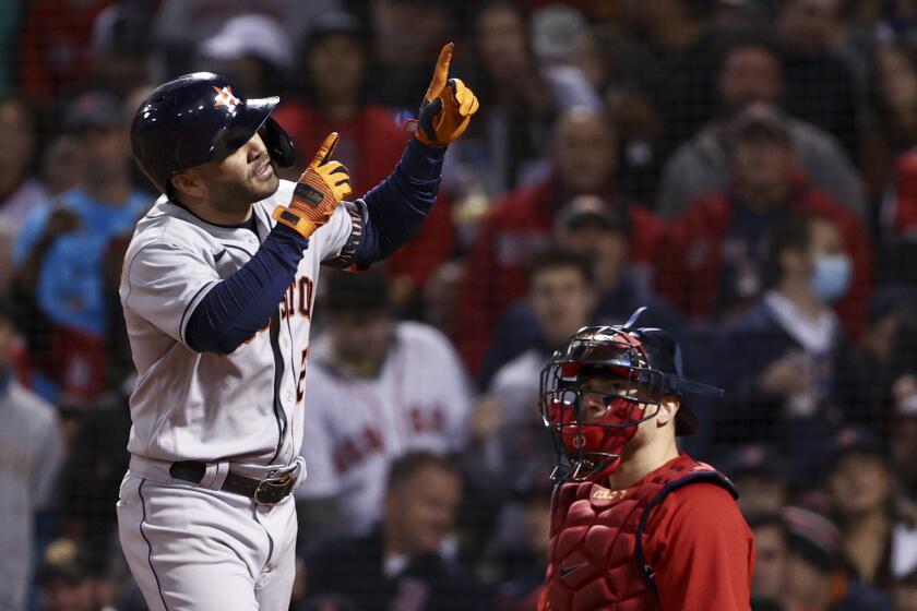 Houston Astros' Jose Altuve celebrates after a home run against the Boston Red Sox during the eighth inning in Game 4 of baseball's American League Championship Series Tuesday, Oct. 19, 2021, in Boston. (AP Photo/Winslow Townson)