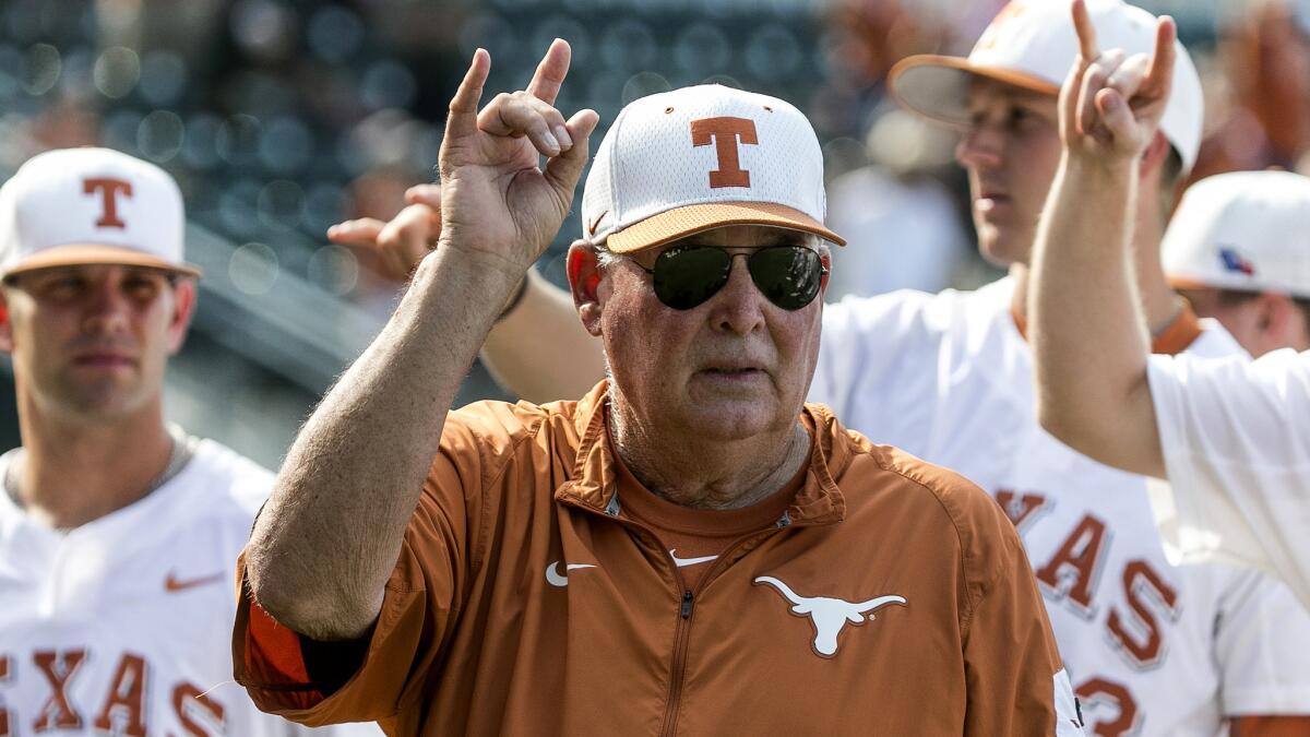 Coach Augie Garrido joins his Texas players in singing the "Eyes of Texas" following a game against Baylor on May 21.