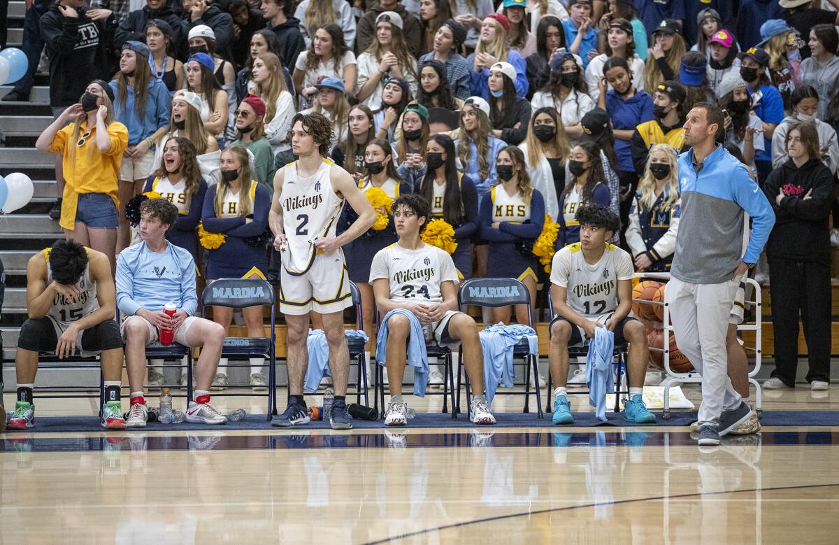 Marina's bench feels the pain of a 75-58 loss to Foothill in a CIF Southern Section Division 2AA playoff game on Tuesday.