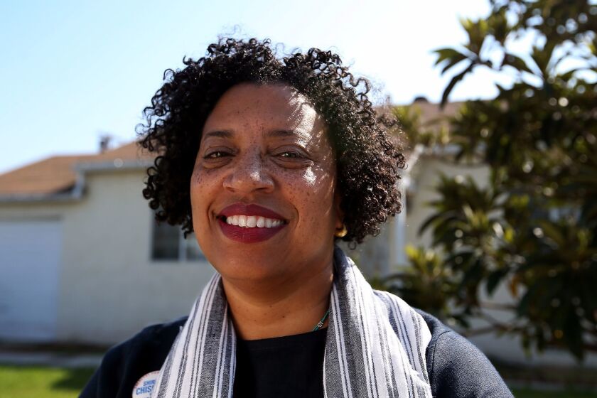 LOS ANGELES, CALIF. - AUG. 29, 2017. National Book Award recipient Robin Coste Lewis in front of her childhood home in Compton. Some of Lewis' poems recall memories of a smaller and closer community, surrounded by farms and fields. "My Compton was middle class, it had incredible style," she says. Lewis is the current poet laureate of Los Angeles. (Luis Sinco/Los Angeles Times)