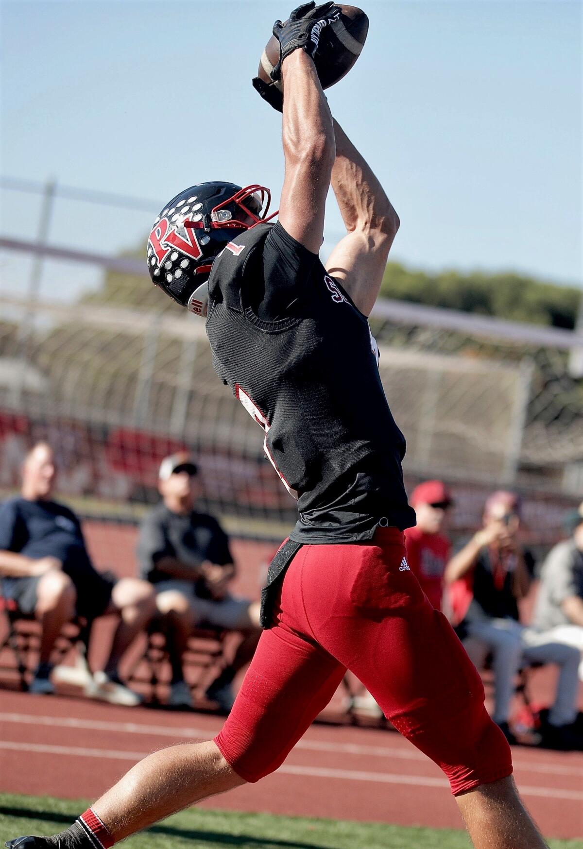 Palos Verdes WR Luke Gayton leaps high in the end zone for the second of his three touchdown catches against Culver City.