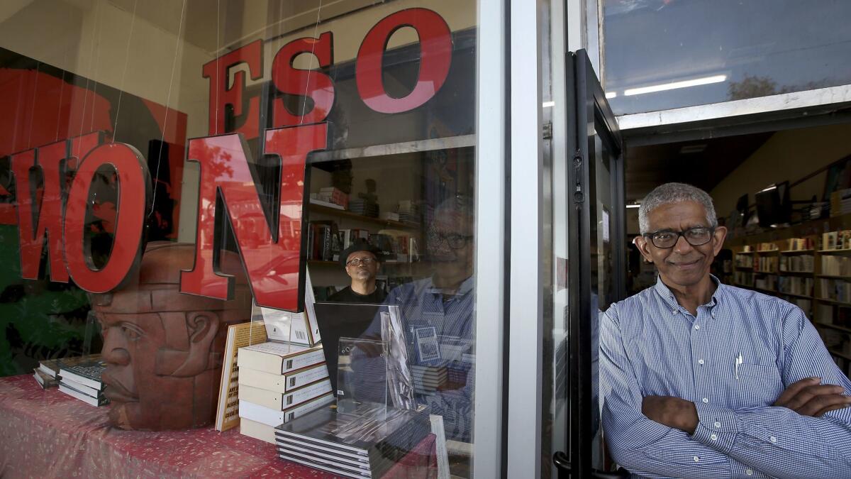 Tom Hamilton, inside left, and James Fugate are the founders and owners of Eso Won Books in Leimert Park.