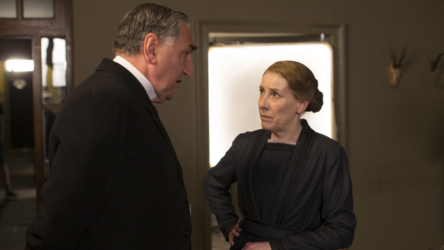 Jim Carter talks to Phyllis Logan before a scene of "Downton Abbey" in the downstairs servant quarter set at Ealing Studios in West London.