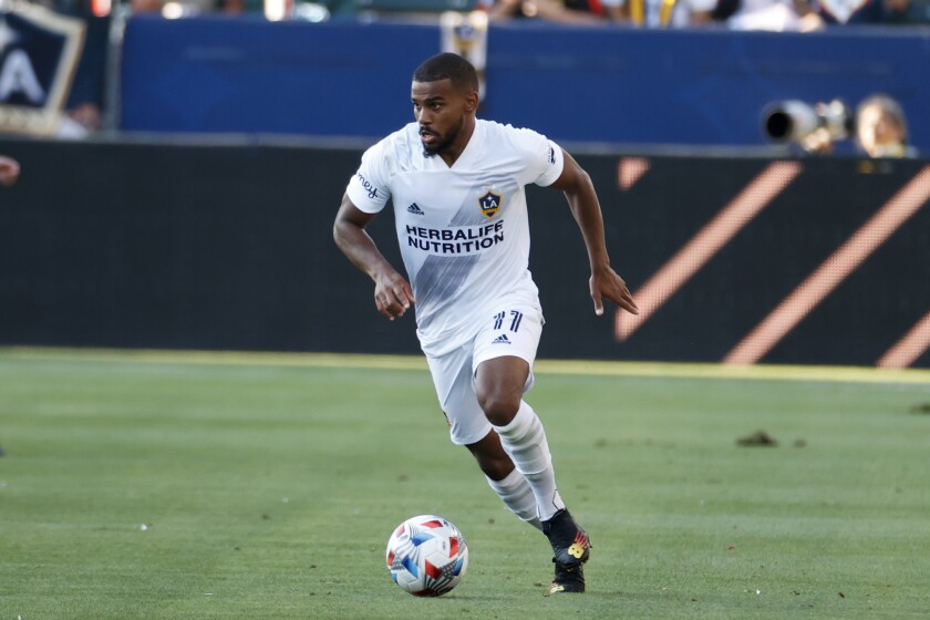 Galaxy midfielder Samuel Grandsir controls the ball.