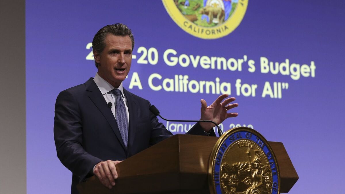 California Gov. Gavin Newsom presents his first state budget, including new spending on healthcare, at a news conference Jan. 10.
