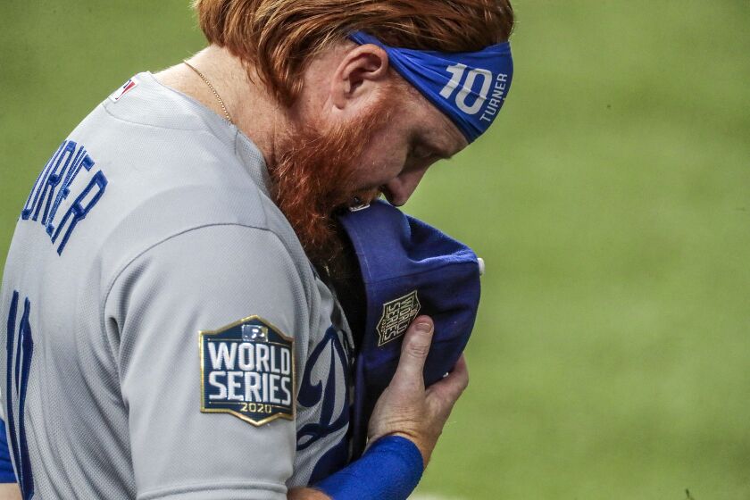 Arlington, Texas, Friday, October 23, 2020 Justin Turner stands for the National Anthem before game three of the World Series at Globe Life Field. (Robert Gauthier/ Los Angeles Times)