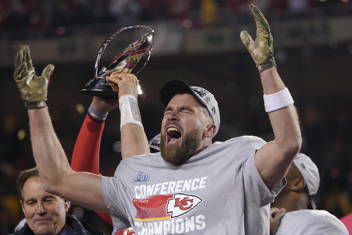 Travis Kelce screams and raises his arms in postgame celebration Sunday