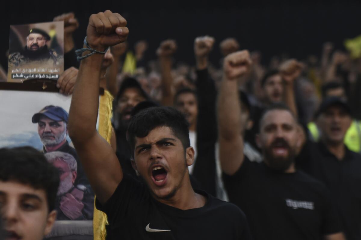 Supporters watch a speech given by Hezbollah leader Sayyed Hassan Nasrallah.