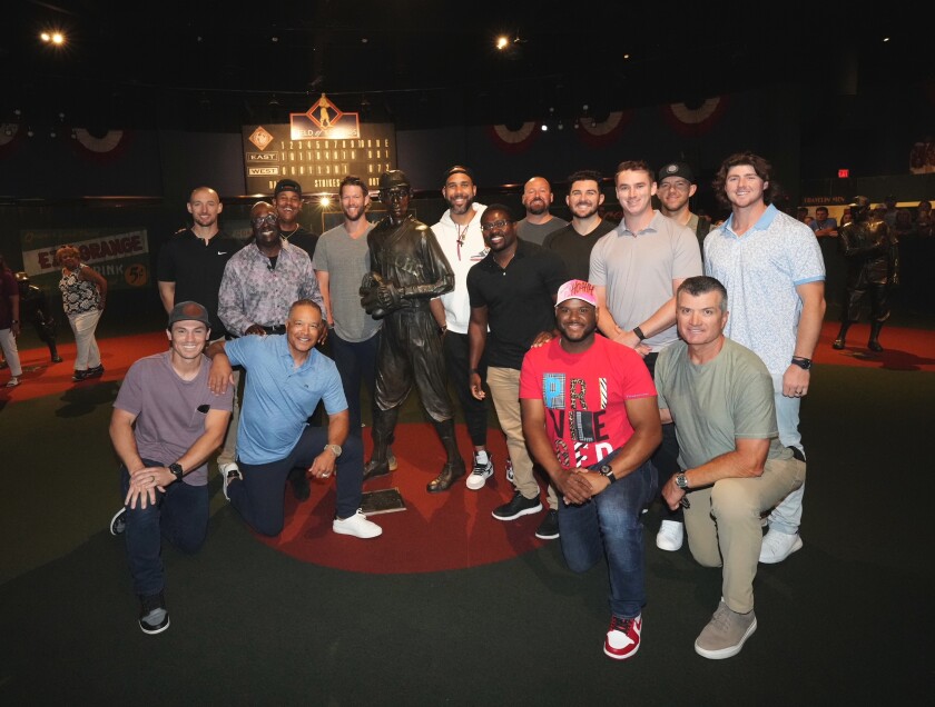 Dodgers players and staff pose for a photo while visiting the Negro Leagues Baseball Museum.