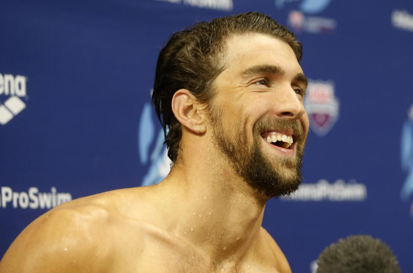 Michael Phelps smiles after winning the men's 200-meter individual medley during the Arena Pro Swim Series on Sunday night.