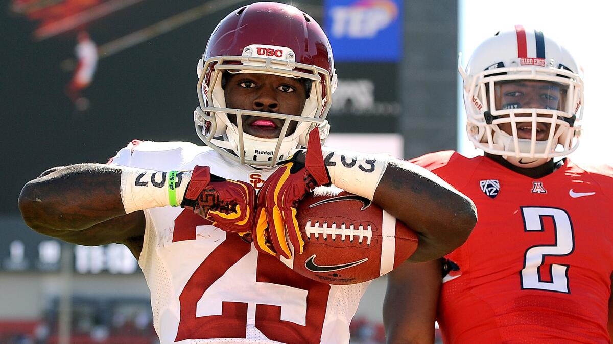 Former Penn State running back Silas Redd celebrates after scoring a touchdown for USC during a Pac-12 game against Arizona on Oct. 27, 2012.