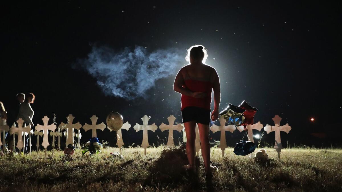 Crosses stand in Sutherland Springs, Texas, to honor the 26 victims killed at the First Baptist Church of Sutherland Springs, where a gunman opened fire at a Sunday service.