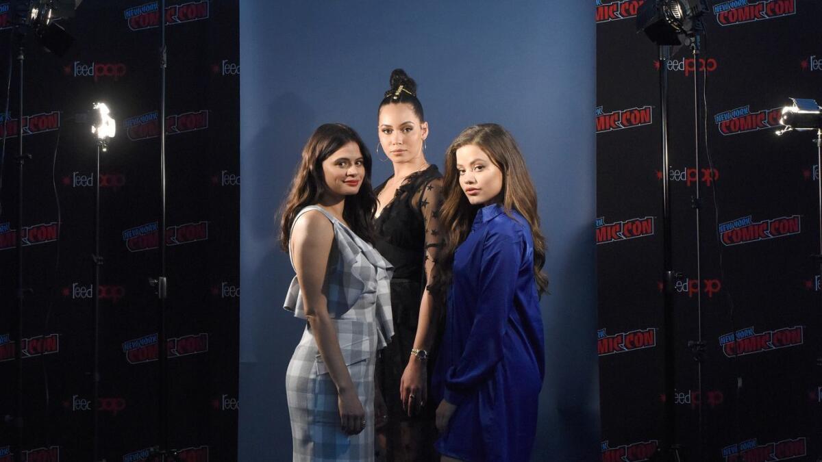 The three stars of The CW's reboot of "Charmed": Melonie Diaz, from left, Madeleine Mantock and Sarah Jeffery.