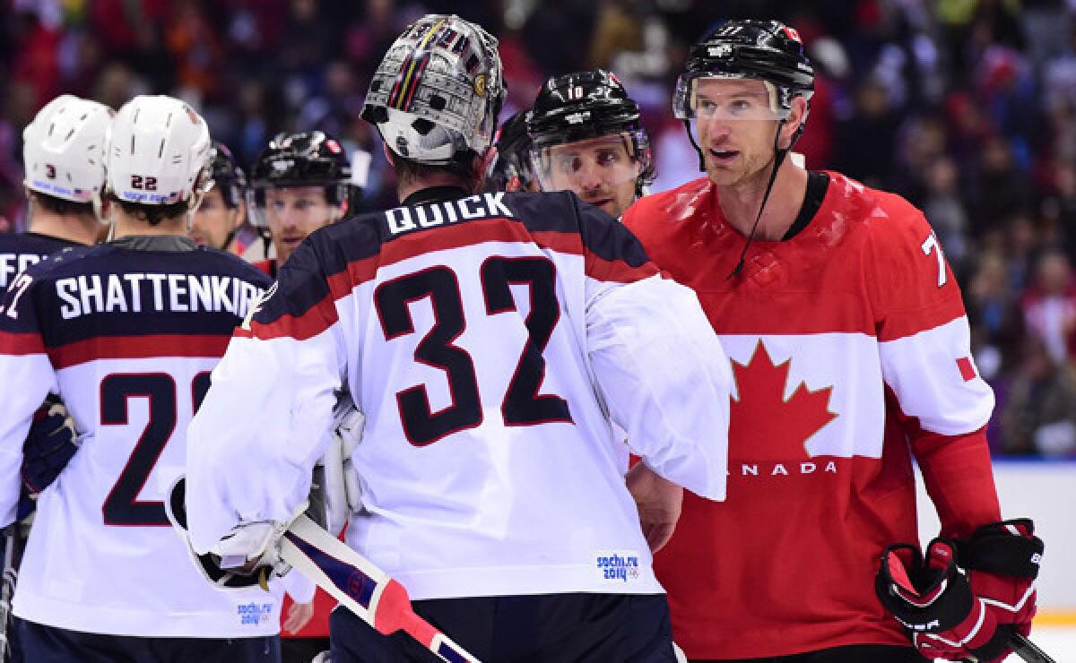 Team USA goalie Jonathan Quick, left, shakes hands with Kings teammate and Team Canada forward Jeff Carter during Canada's 1-0 semifinal win at the Sochi Winter Olympic Games on Friday.