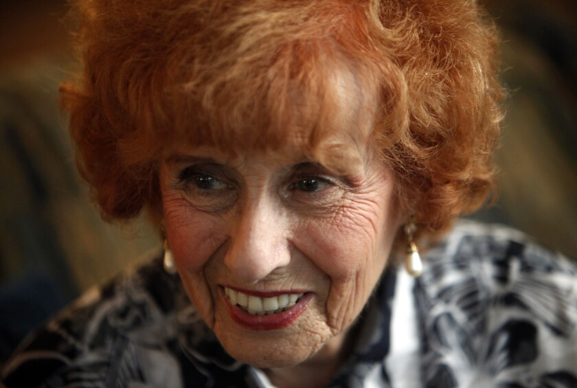 Elinor Otto, 93, in the living room of her home in Long Beach. If she were younger, she jokes, she would look at herself now and wonder, "What's that old bag still doing here?"