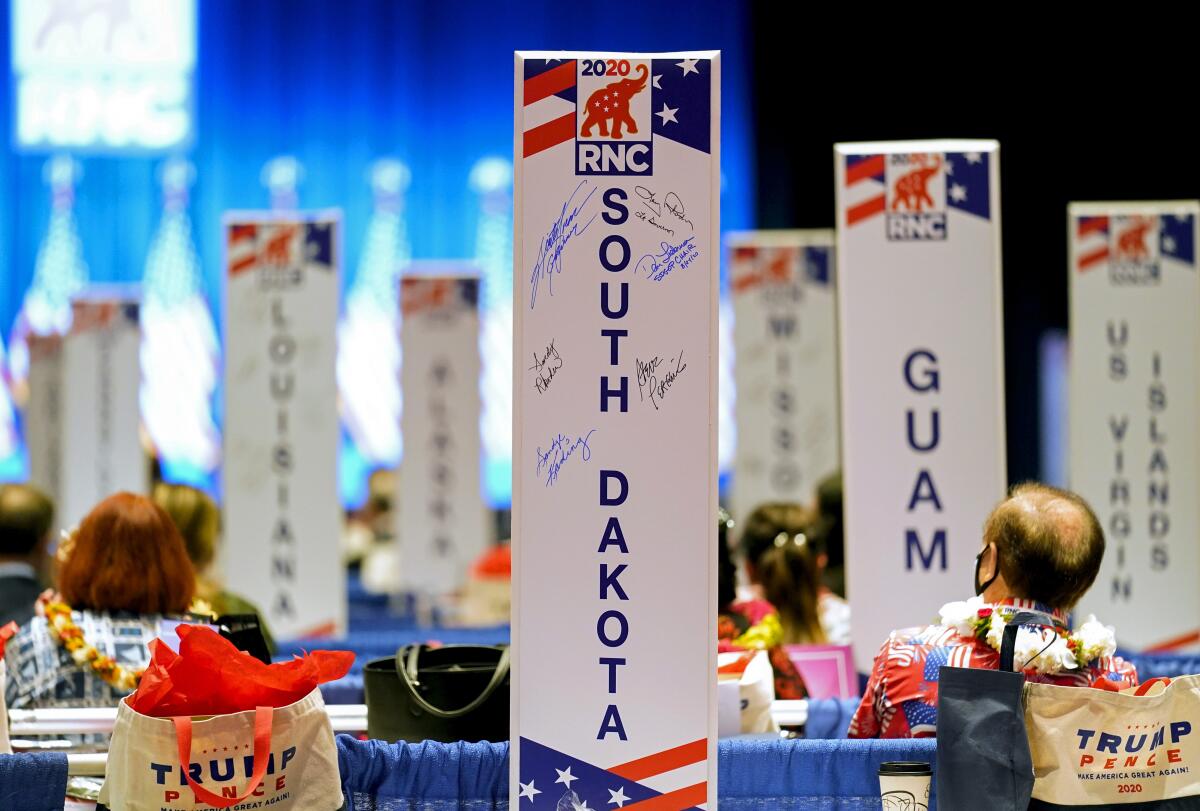 Delegates watch the roll call vote of states at the 2020 Republican National Convention in Charlotte, N.C.