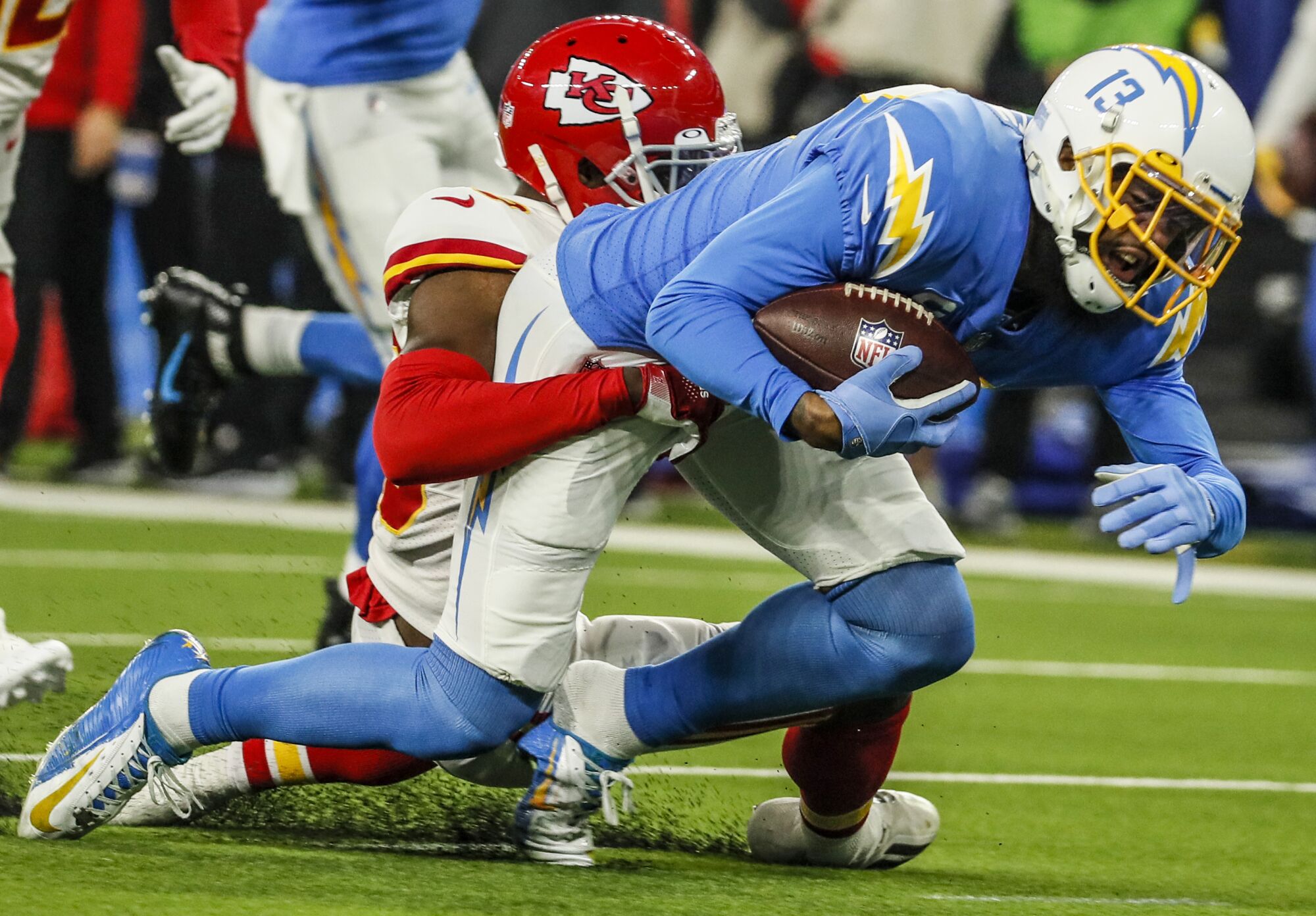 Chargers wide receiver Keenan Allen has his shoe pulled off as he is tackled by Kansas City Chiefs cornerback Deandre Baker.