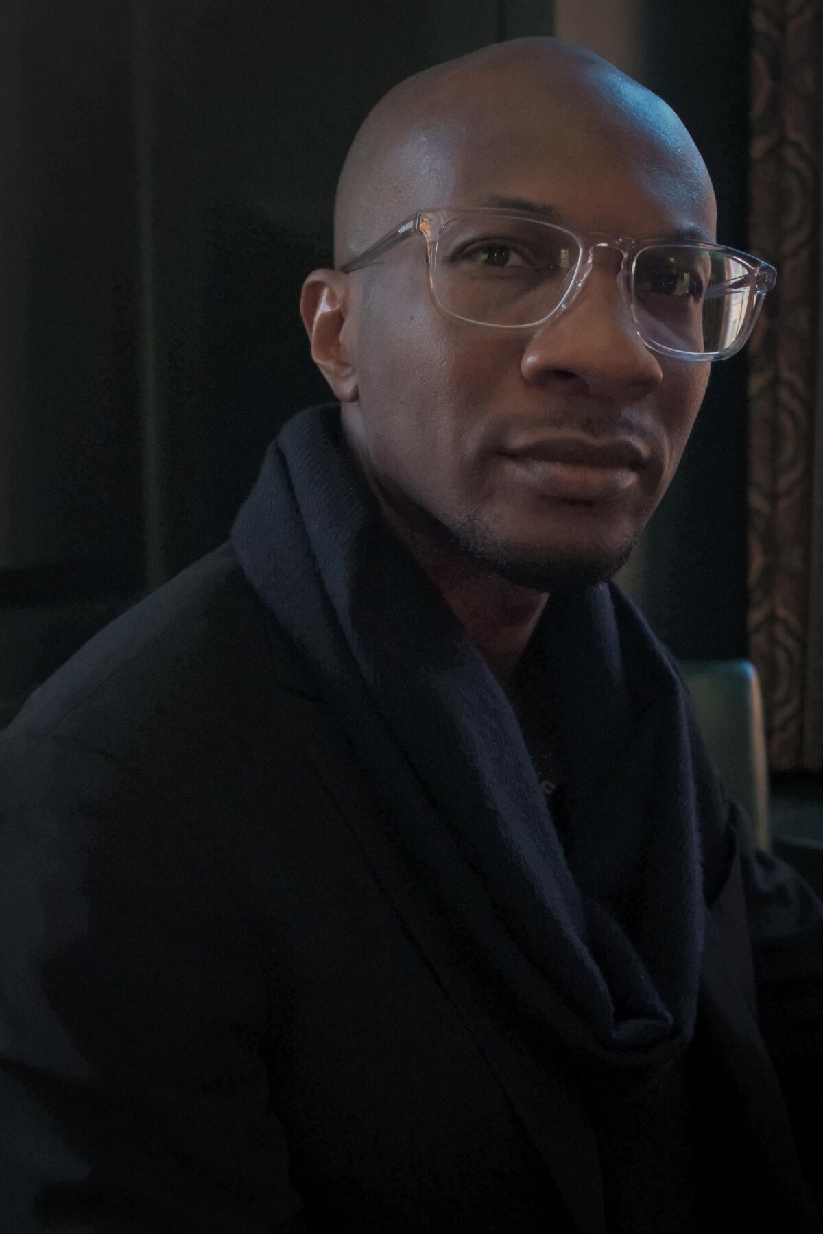 A Black man wearing glasses