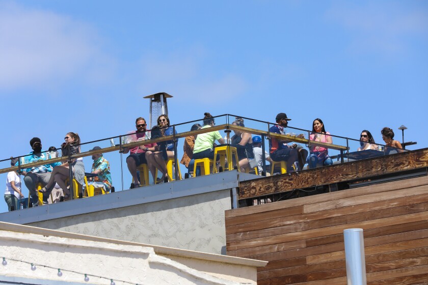 Diners eat on the rooftop at The Holding in Ocean Beach, which opened just in time for the Memorial Day holiday.