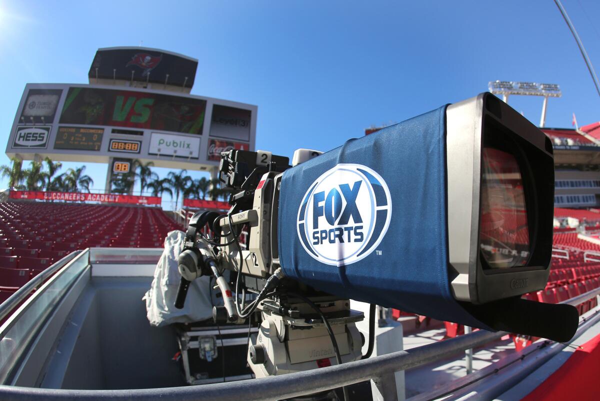 A FOX Network camera stands ready before the first half of an NFL football game. Toby Byrne has been in charge of ad sales for the Fox broadcast network and Fox Sports since 2010.