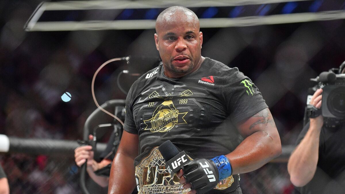 Daniel Cormier addresses the crowd after winning his heavyweight championship fight against Stipe Miocic at T-Mobile Arena on July 7 in Las Vegas. Cormier won by first-round knockout.