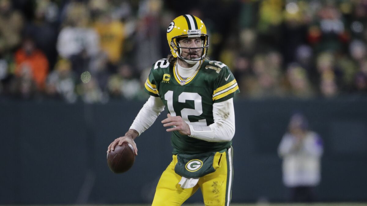 Green Bay Packers' Aaron Rodgers sets to throw at Lambeau Field.